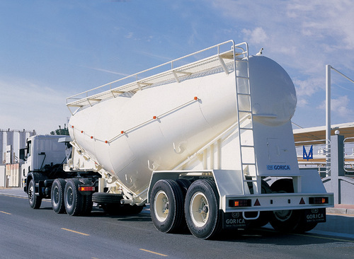 White cement bulk tanker trailer with access ladder and handrails