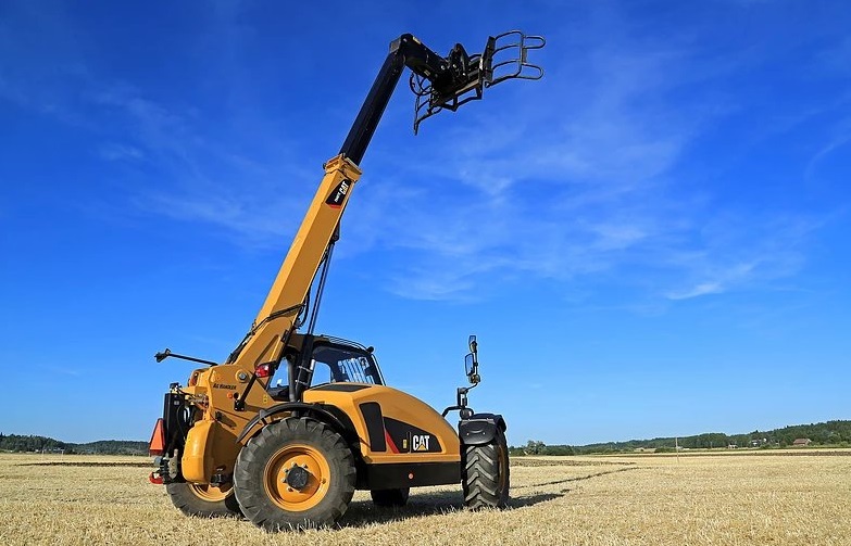 Telescopic handler with boom extended on open ground